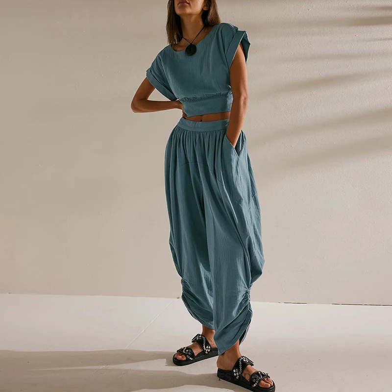 Women Casual Holiday 2 Piece Set New 2025 Summer O Neck Short Sleeved Top + Wide Leg Pants Outfit Simple Solid Pocket Loose Suit
Women Casual Holiday 2 Piece Set New 2025 Summer O Neck Short Sleeved Top + Wide Leg Pants Outfit Simple Solid Pocket Loose Suit