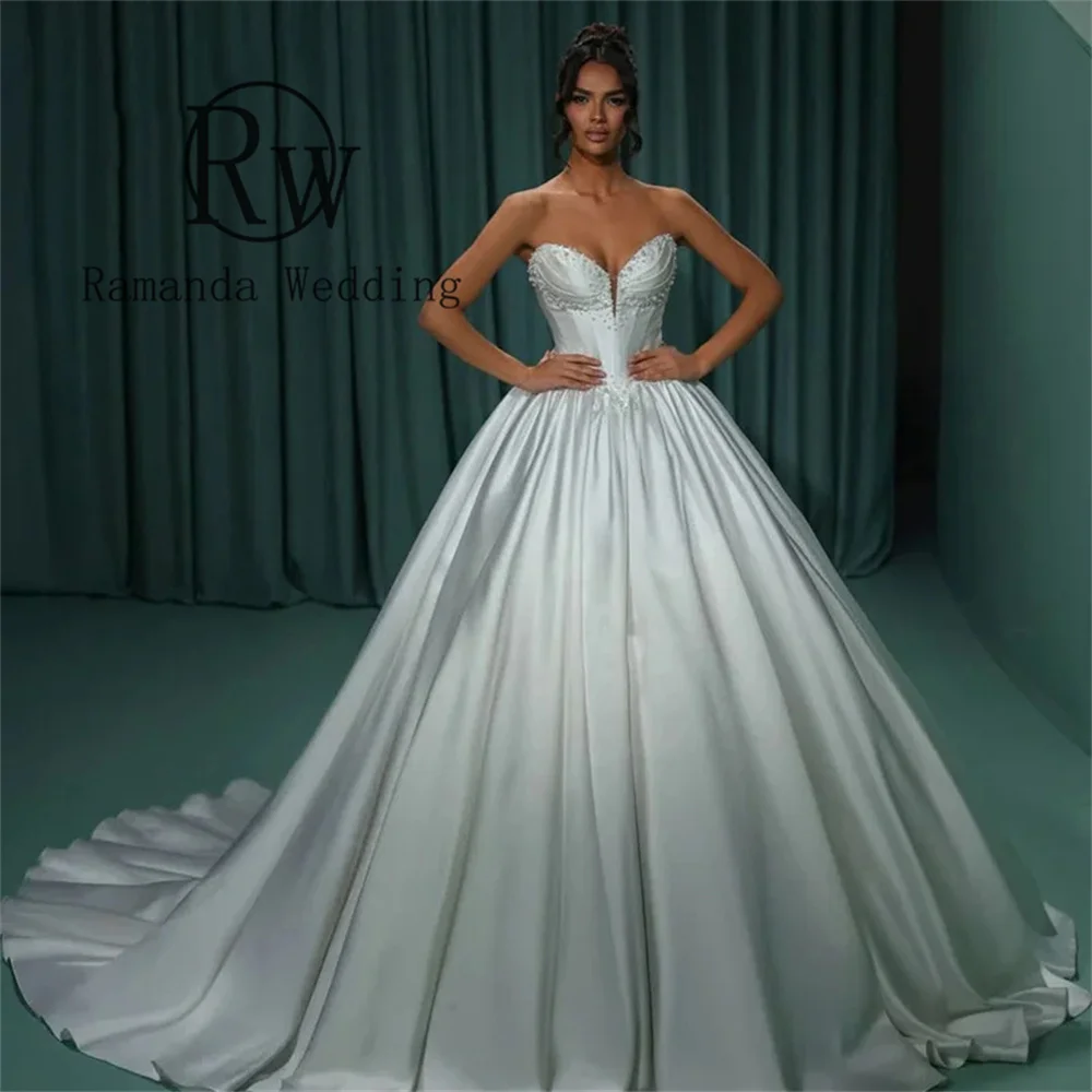 Ramanda Sweetheart Backless Vintage Wedding Dresses Ruffles A-Line Princess Vintage Beads Sleeveless Sweep Train 2025 Customzied
Ramanda Sweetheart Backless Vintage Wedding Dresses Ruffles A-Line Princess Vintage Beads Sleeveless Sweep Train 2025 Customzied