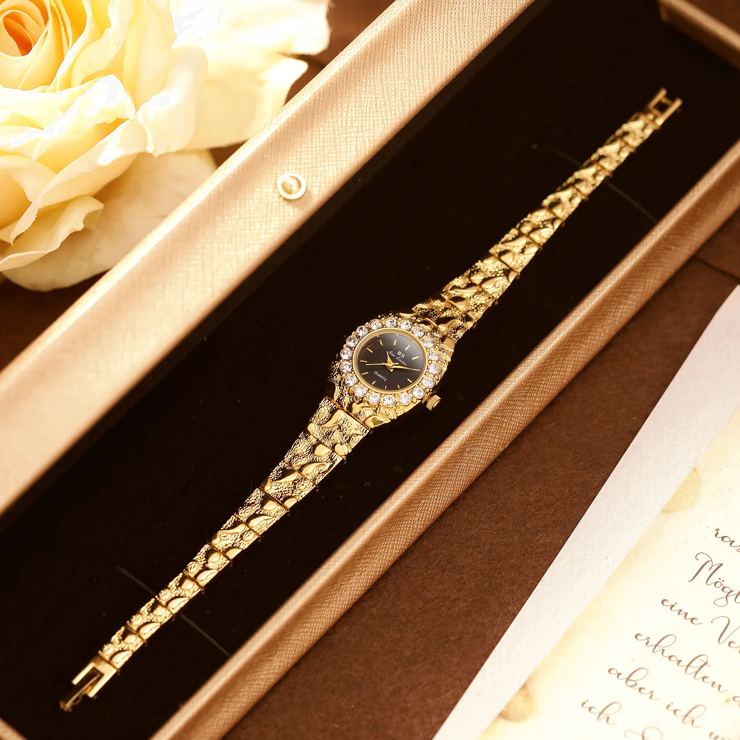 A niche, luxurious atmosphere with lava-colored black and gold, vintage diamondwatch, elegant gift watch, petite size.
A niche, luxurious atmosphere with lava-colored black and gold, vintage diamondwatch, elegant gift watch, petite size.