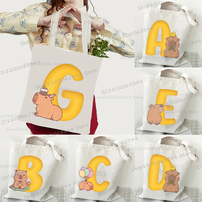 26 Alphabet Capybara Print Women's Handbags Fashion Cartoon Capybara Korean Style Aesthetics Shoulder Bag Girls Canvas Tote Bag
26 Alphabet Capybara Print Women's Handbags Fashion Cartoon Capybara Korean Style Aesthetics Shoulder Bag Girls Canvas Tote Bag