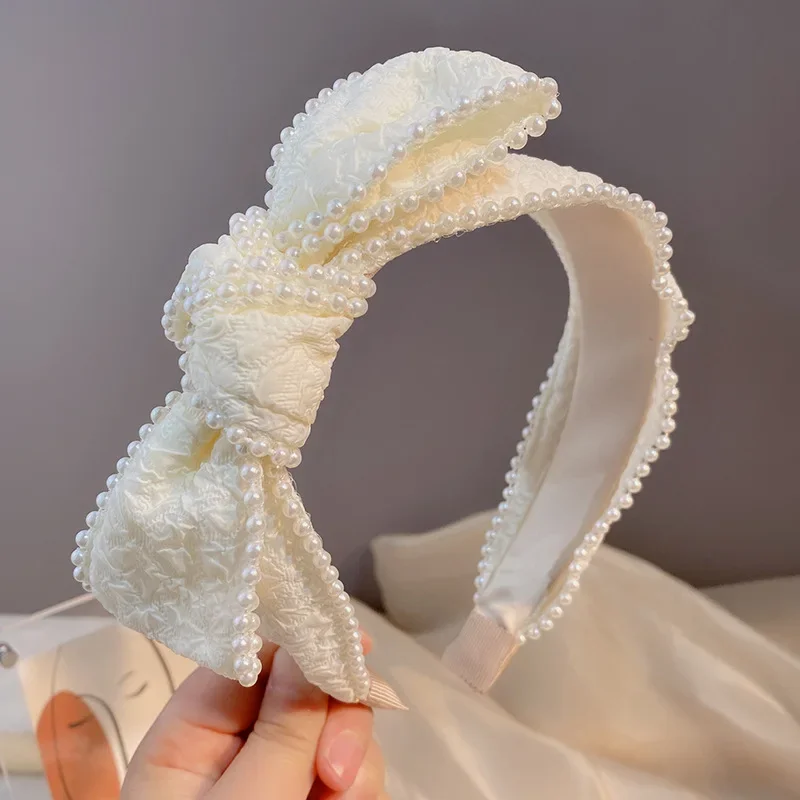 Japanese small fresh white fabric headband women's vintage pearl bow temperament wide edge headdress pleated headband
Japanese small fresh white fabric headband women's vintage pearl bow temperament wide edge headdress pleated headband