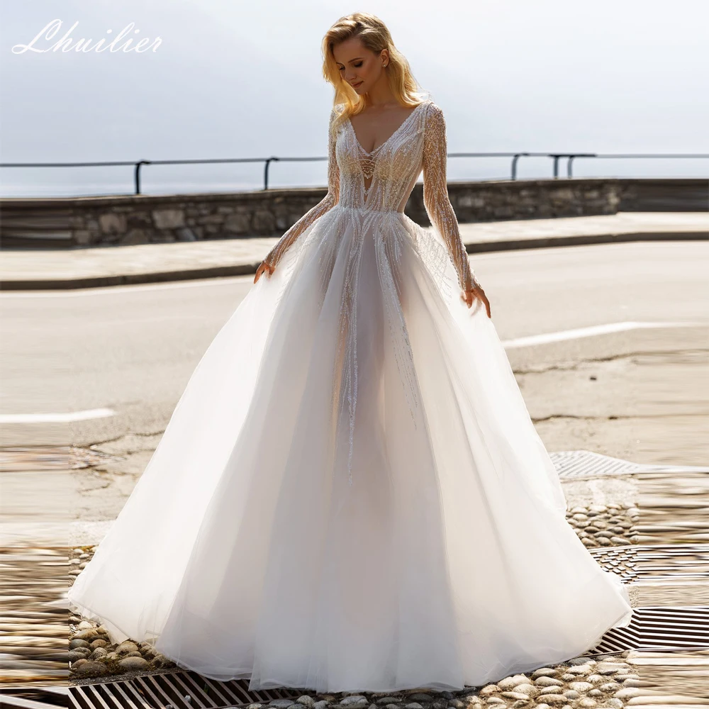 Lhuilier Customized A Line V Neck Backless Tulle Wedding Dresses Full Sleeves Sequined Illusion Bridal Gowns with Court Train
Lhuilier Customized A Line V Neck Backless Tulle Wedding Dresses Full Sleeves Sequined Illusion Bridal Gowns with Court Train