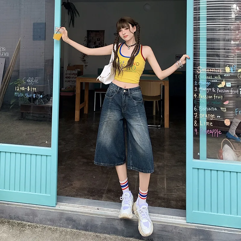 Washed Dark Blue Loose Seven-inch Jeans. New Summer Fashion and Casual High-waisted Splicing Wide-leg Denim Shorts for Women
Washed Dark Blue Loose Seven-inch Jeans. New Summer Fashion and Casual High-waisted Splicing Wide-leg Denim Shorts for Women