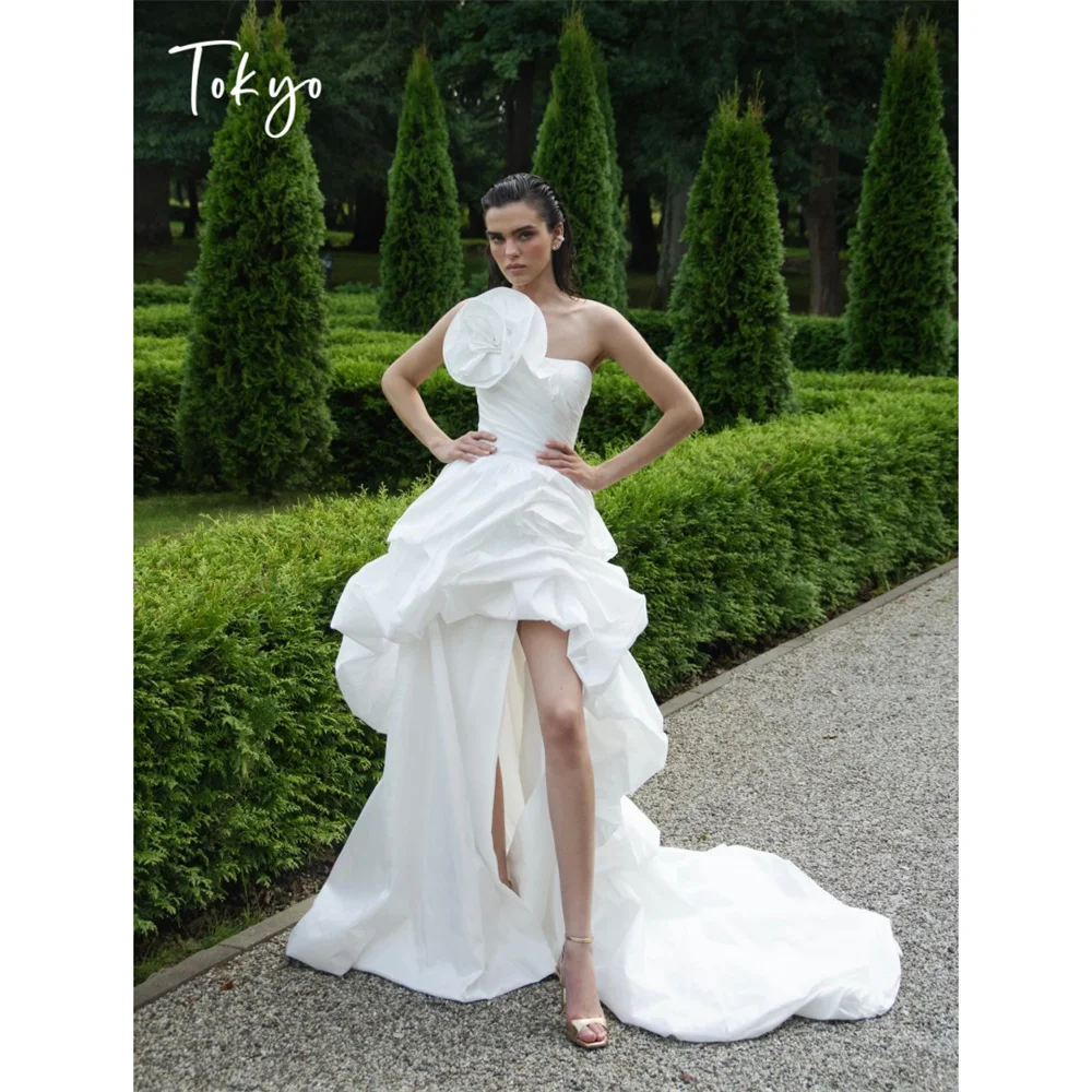 Tokyo One Shoulder 3D Flower Wedding Dress High Low High Split Bridal Gown Ruffled Pleated Satin Formal Evening Prom Dress 2026
Tokyo One Shoulder 3D Flower Wedding Dress High Low High Split Bridal Gown Ruffled Pleated Satin Formal Evening Prom Dress 2026