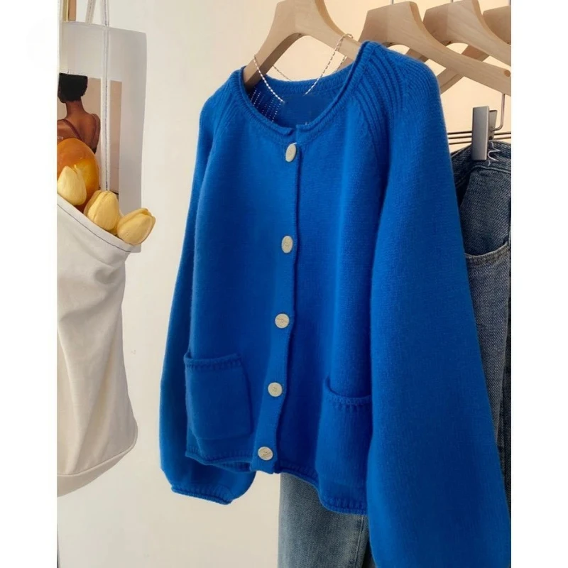 Autumn Winter Women Vintage Simple Chic Single Breasted Knitted Cardigan Y2K Casual O Neck Long Sleeve Pocket Loose Sweater Coat
Autumn Winter Women Vintage Simple Chic Single Breasted Knitted Cardigan Y2K Casual O Neck Long Sleeve Pocket Loose Sweater Coat