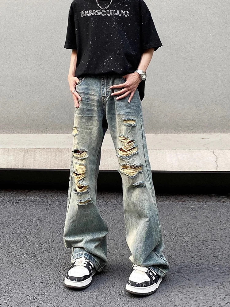 Мужские джинсы с американской талией в стиле ретро, летние свободные брюки-клеш, модные рваные и состаренные хлопковые и полиэстеровые джинсы
Мужские джинсы с американской талией в стиле ретро, летние свободные брюки-клеш, модные рваные и состаренные хлопковые и полиэстеровые джинсы