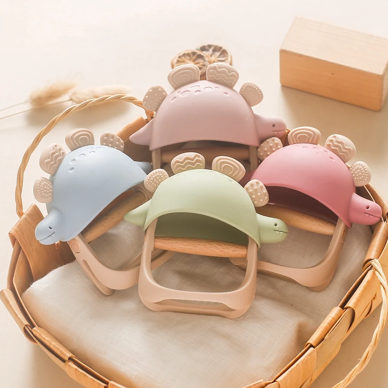1PC Silicone Teether Baby Dinosaur Glove Teether Wooden Teether Ring Kid Gift BPA Free Silicone Children Goods Kid Teething Toy
1PC Silicone Teether Baby Dinosaur Glove Teether Wooden Teether Ring Kid Gift BPA Free Silicone Children Goods Kid Teething Toy