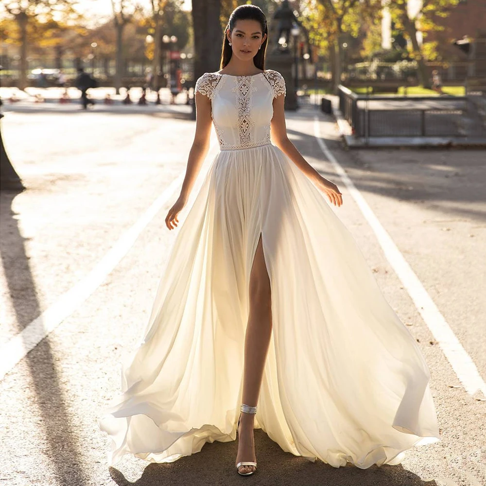 2023 Boho Wedding Dresses Chiffon Lace Beach Slit Short Sleeves V-Back Bride Dress Bridal Gowns Bohemian Elegant Sweep Train
2023 Boho Wedding Dresses Chiffon Lace Beach Slit Short Sleeves V-Back Bride Dress Bridal Gowns Bohemian Elegant Sweep Train