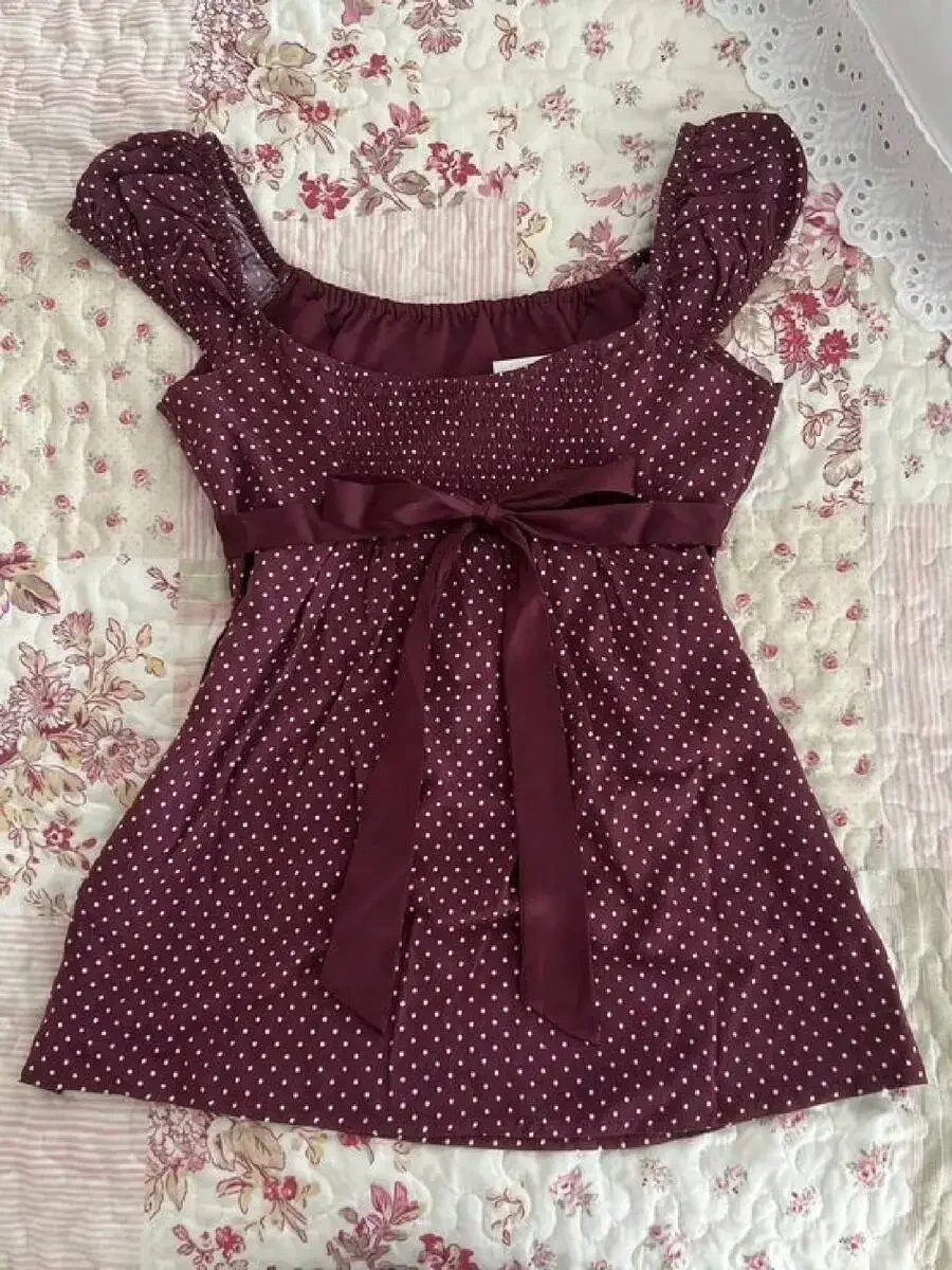 Women Polka Dot Cap Sleeve Flowy Top With Bow Tie Back
Women Polka Dot Cap Sleeve Flowy Top With Bow Tie Back