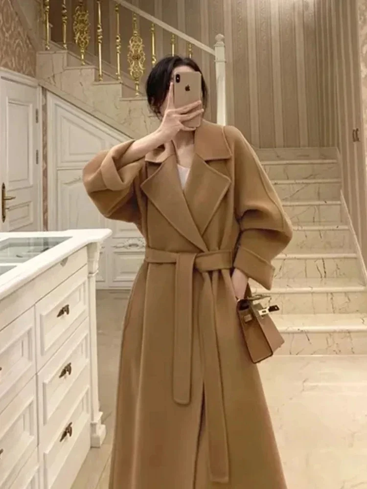 Korean Fashion Wool Coat Belt Black Woolen Long Coat for Women Oversize Loose Lapel Overcoat Autumn Lady High Street Outerwear
Korean Fashion Wool Coat Belt Black Woolen Long Coat for Women Oversize Loose Lapel Overcoat Autumn Lady High Street Outerwear