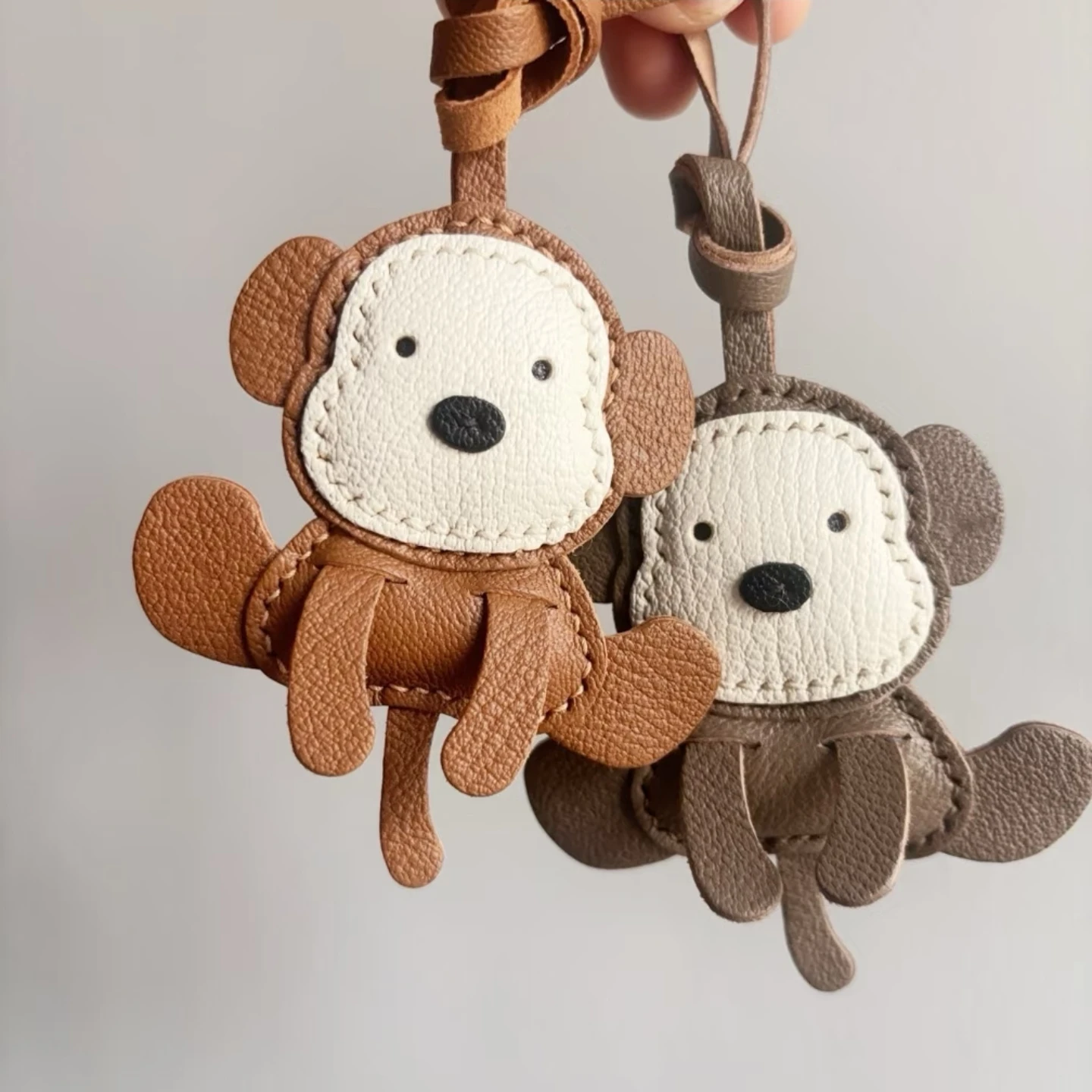 Hand-sewn genuine leather keychain little monkey design cute accessory for bags car keys and backpacks a perfect gift for girls
Hand-sewn genuine leather keychain little monkey design cute accessory for bags car keys and backpacks a perfect gift for girls