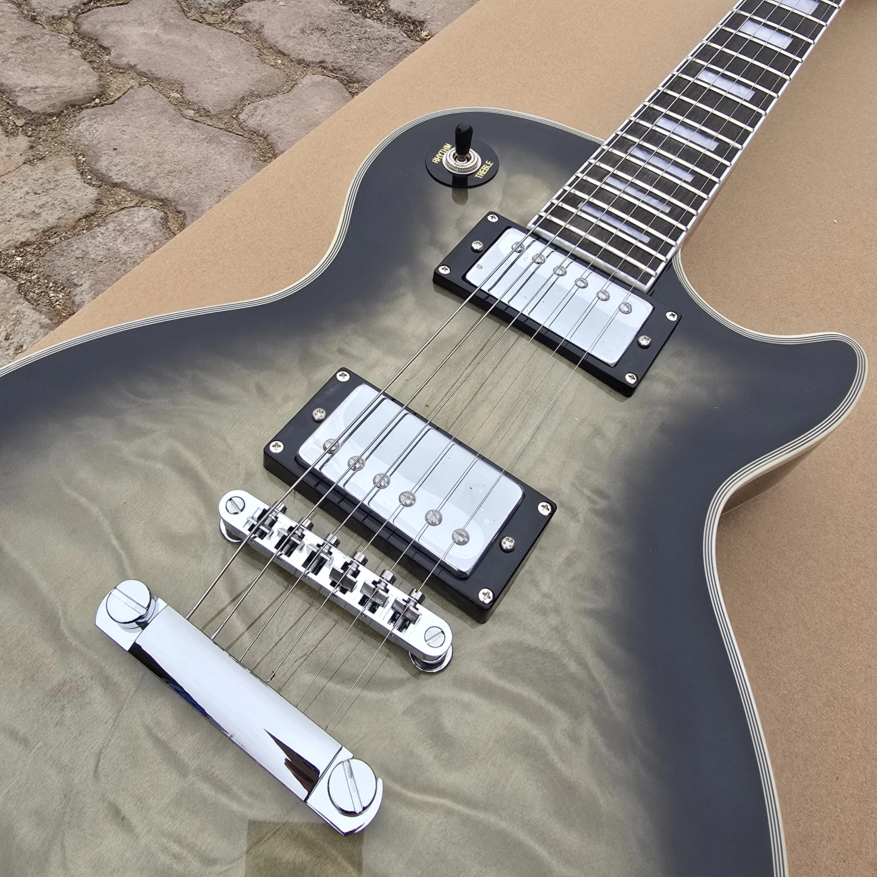 Electric guitar Solid Mahogany Body Transparent black Guitar Rosewood Fingerboard
Electric guitar Solid Mahogany Body Transparent black Guitar Rosewood Fingerboard