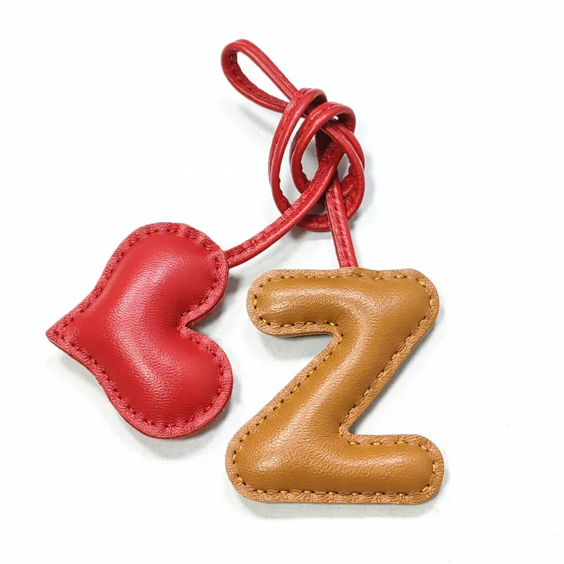 Genuine leather Z with heart-shaped letter style bag decoration with pure handmade stitching, high-end car keychain accessories
Genuine leather Z with heart-shaped letter style bag decoration with pure handmade stitching, high-end car keychain accessories