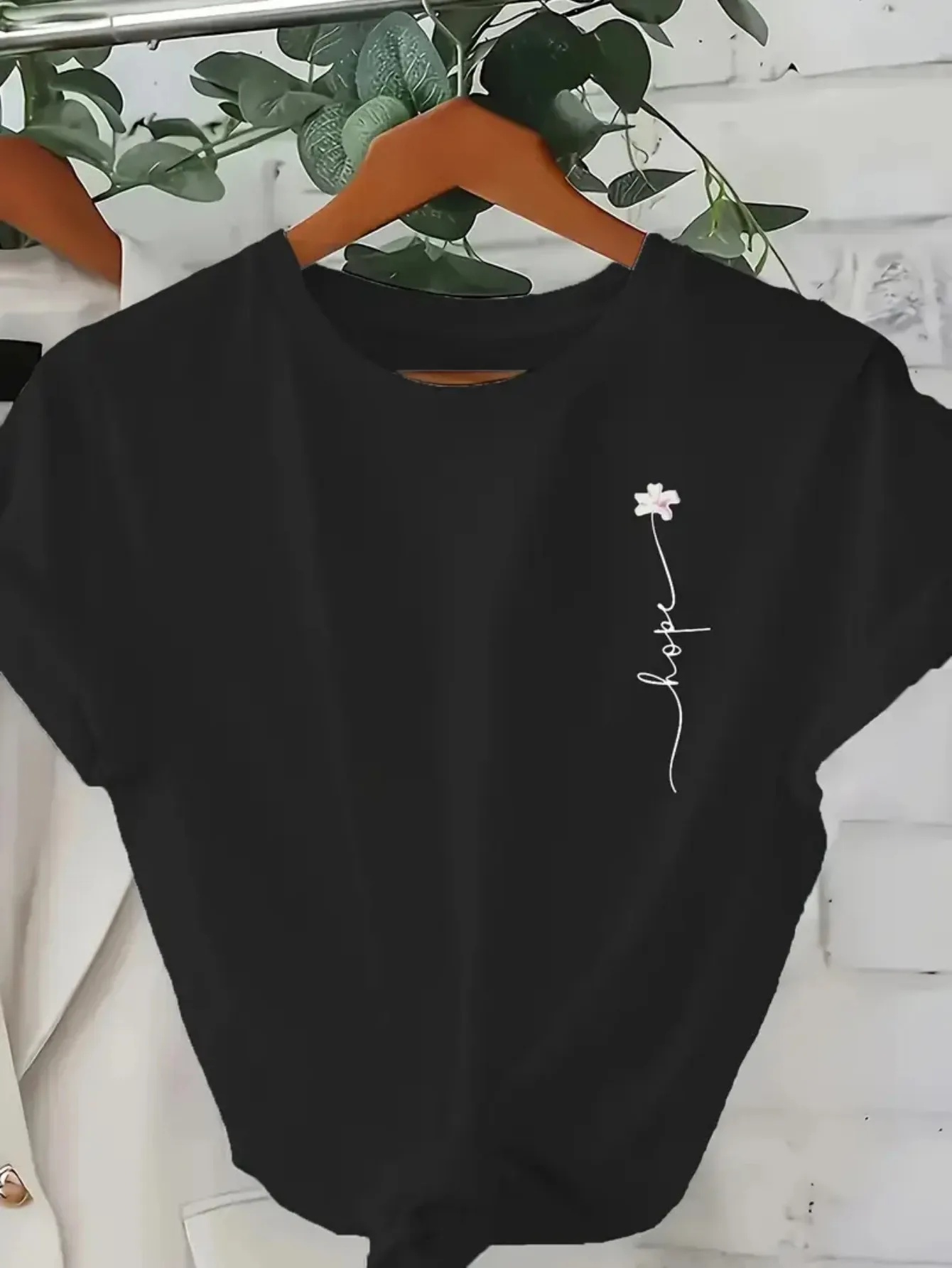 Women's Black 100% Cotton Relaxed Fit T-Shirt - Minimalist Graphic Print with White Floral & Letter Design Breathable Round Neck
Women's Black 100% Cotton Relaxed Fit T-Shirt - Minimalist Graphic Print with White Floral & Letter Design Breathable Round Neck