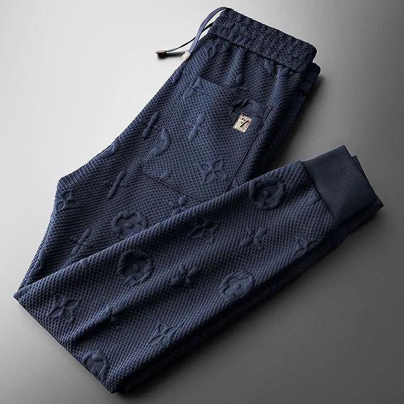 Spring and autumn high-end light luxury jacquard fashion trend men's slim-fit sports knitted casual pants
Spring and autumn high-end light luxury jacquard fashion trend men's slim-fit sports knitted casual pants