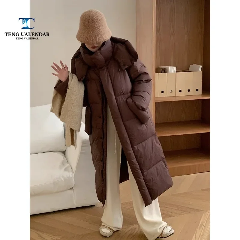 Korean Version Down Jacket, Super Long Over Knee, Ankle Blanket, Thick Hooded Jacket, Women's New Model, 2024
Korean Version Down Jacket, Super Long Over Knee, Ankle Blanket, Thick Hooded Jacket, Women's New Model, 2024