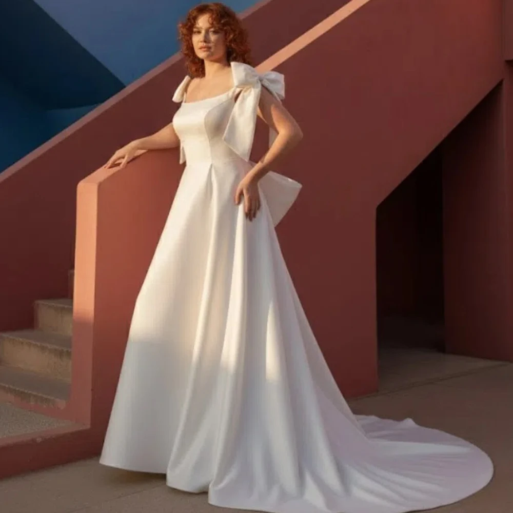 Modern White Satin A Line Wedding Dress with Bow Shoulder Straps and Lace Up Back Women Square Collar Bridal Gowns Customized
Modern White Satin A Line Wedding Dress with Bow Shoulder Straps and Lace Up Back Women Square Collar Bridal Gowns Customized
