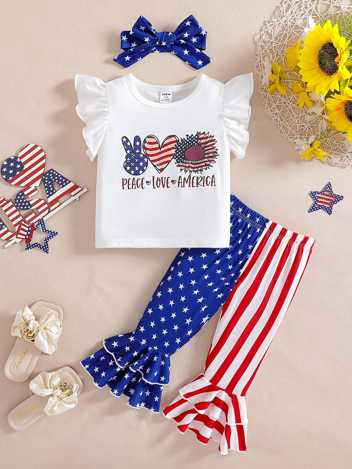 Independence Day themed baby girl set with flying sleeves printed top, star striped flag flared pants with hair accessories
Independence Day themed baby girl set with flying sleeves printed top, star striped flag flared pants with hair accessories