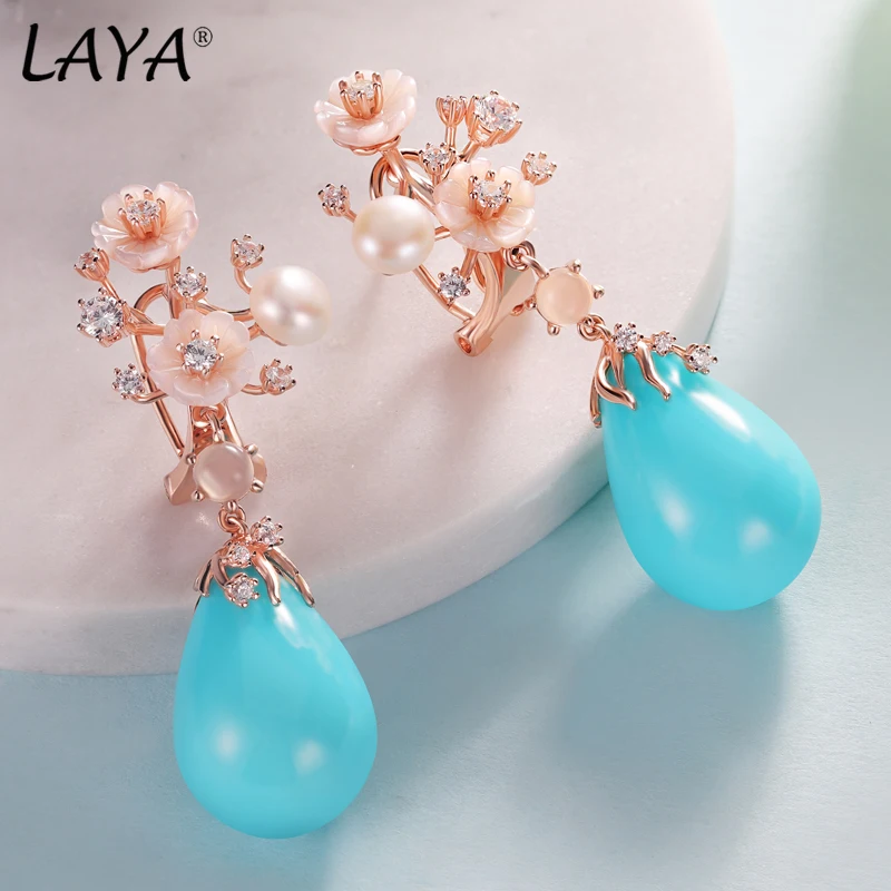 Laya 925 Sterling Silver White Jade Pulp Zircon Natural Shell Flower Turquoise Pearl Drop Earrings For Women Fashion Jewelry
Laya 925 Sterling Silver White Jade Pulp Zircon Natural Shell Flower Turquoise Pearl Drop Earrings For Women Fashion Jewelry