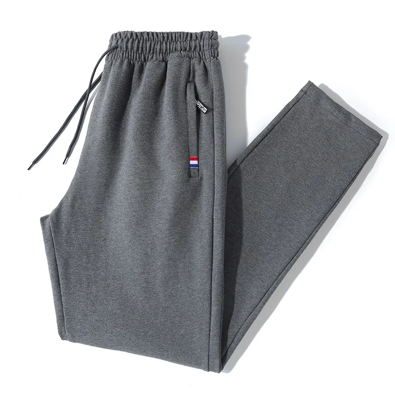 Tri color logo with thick velvet winter men's sports pants, men's polyester sanitary pants, knitted casual pants, oversized loos
Tri color logo with thick velvet winter men's sports pants, men's polyester sanitary pants, knitted casual pants, oversized loos