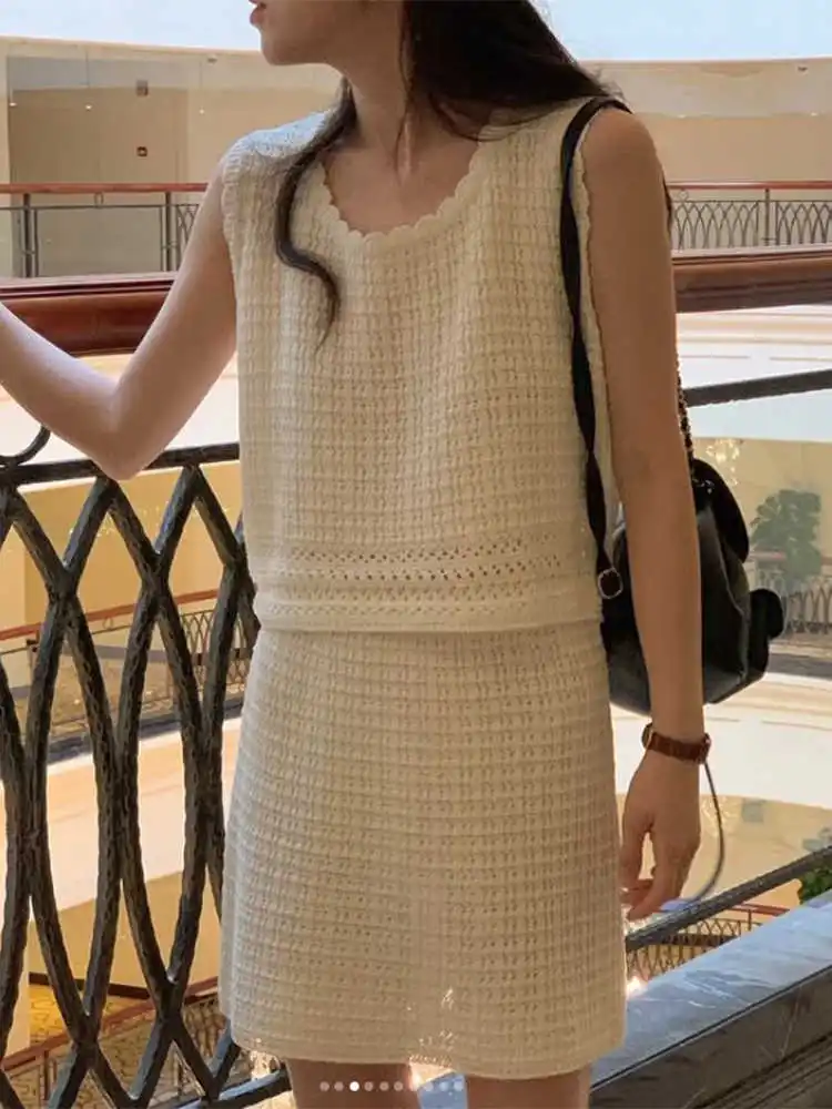 Clothland Women Stylish Knitting Blouse Skirt Set Sleeveless Hollow Out Vest Shirt Mini Skirts Cute Two Piece Suit TA619
Clothland Women Stylish Knitting Blouse Skirt Set Sleeveless Hollow Out Vest Shirt Mini Skirts Cute Two Piece Suit TA619