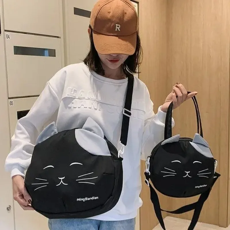 Стильная нейлоновая сумка с рисунком кота из мультфильма, женская сумка через плечо, модная универсальная женская сумка-тоут на молнии с подкладкой
Стильная нейлоновая сумка с рисунком кота из мультфильма, женская сумка через плечо, модная универсальная женская сумка-тоут на молнии с подкладкой