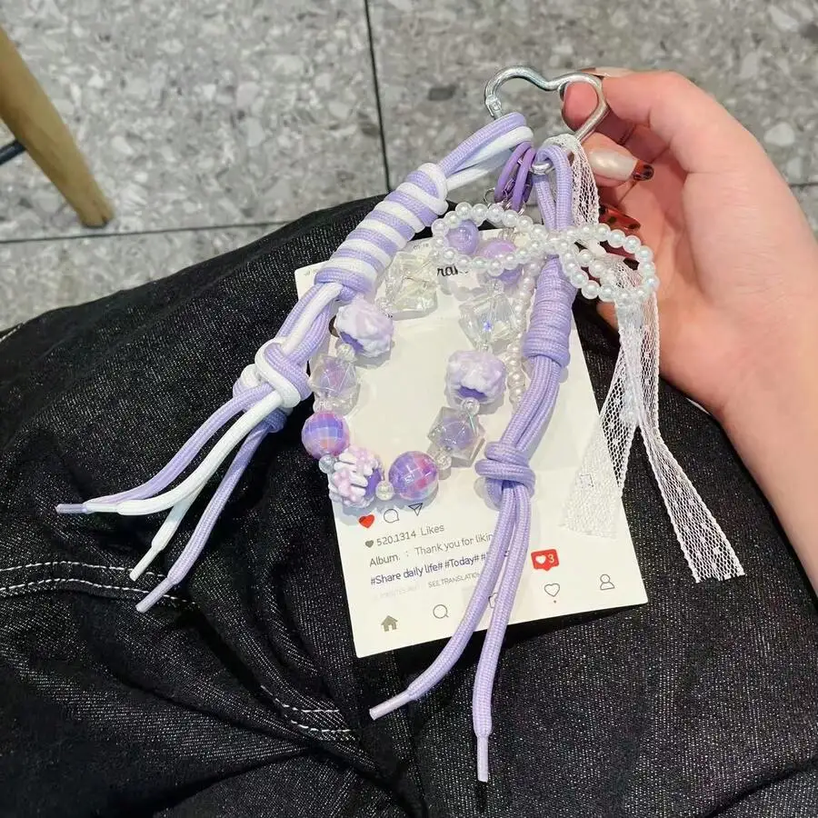 Woven Purple And White String Bag Charm Beaded Phone Pendant Keychain
Woven Purple And White String Bag Charm Beaded Phone Pendant Keychain