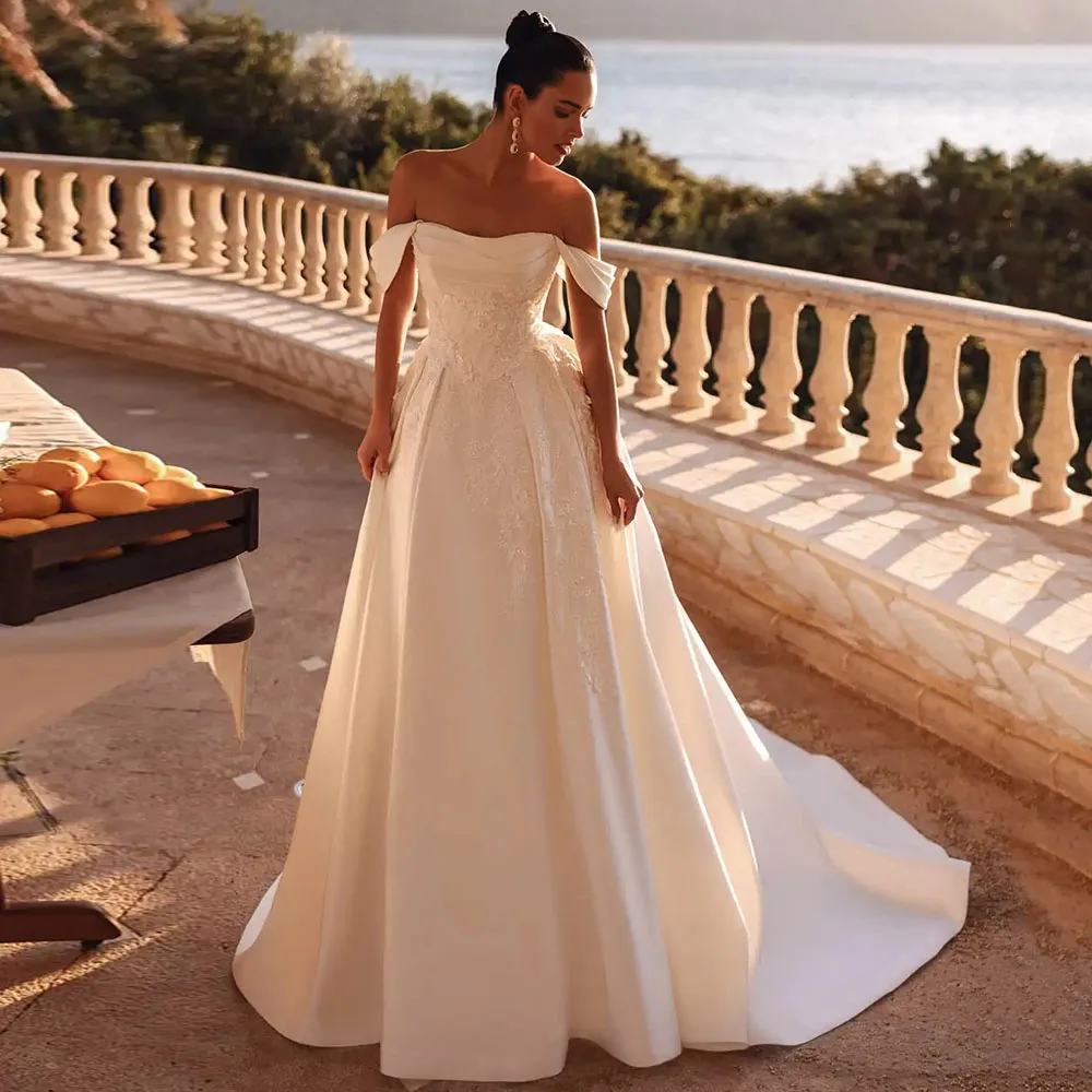 Modern Off the Shoulder Appliques Wedding Dresses for Women Customized Satin A-Line Backless Bridal Gowns Vestidos De Novia 2026
Modern Off the Shoulder Appliques Wedding Dresses for Women Customized Satin A-Line Backless Bridal Gowns Vestidos De Novia 2026