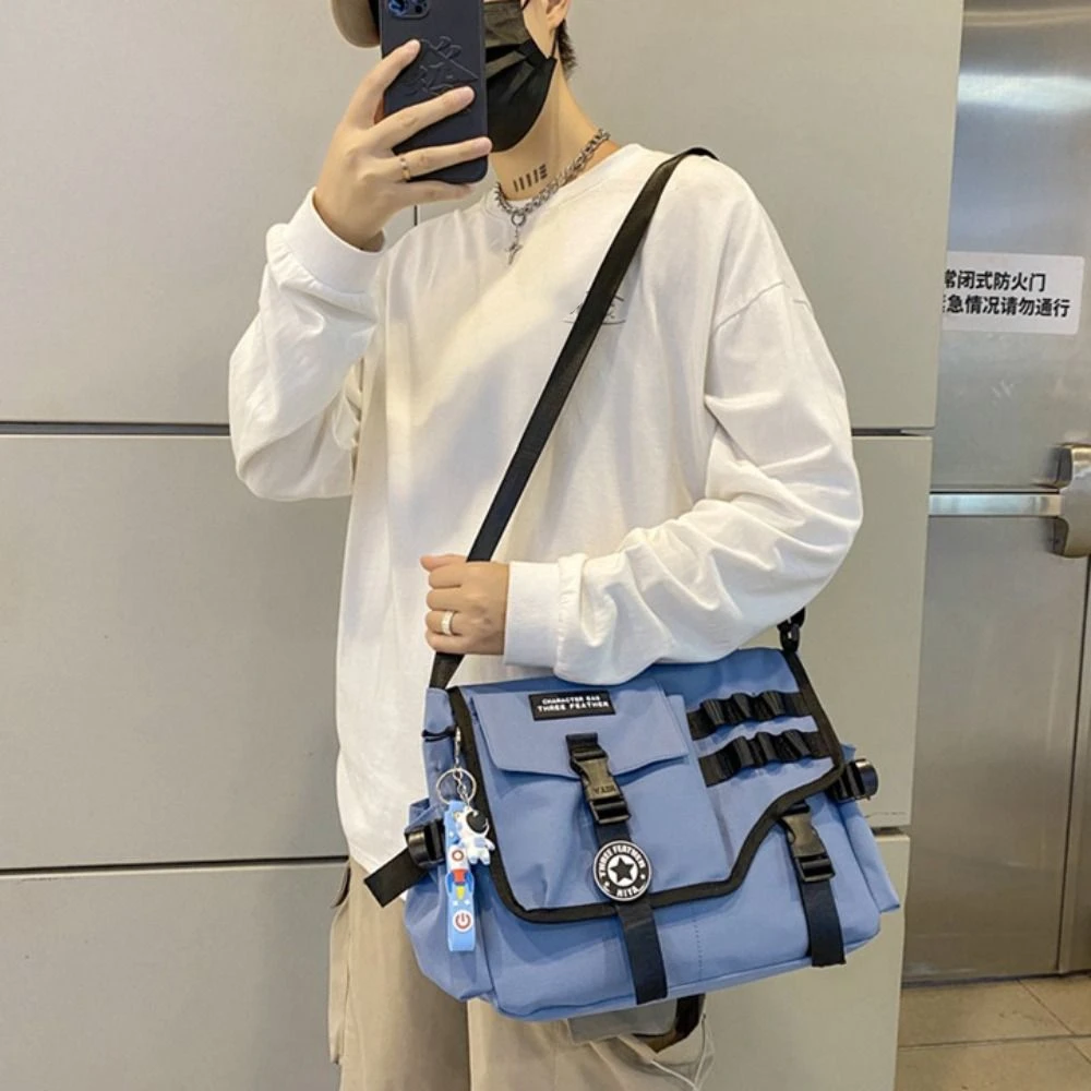 Harajuku Men Crossbody Bag Large Capacity Japanese Style Nylon Postman Bag with Pendant Lightweight Casual Messenger Bag Boys
Harajuku Men Crossbody Bag Large Capacity Japanese Style Nylon Postman Bag with Pendant Lightweight Casual Messenger Bag Boys