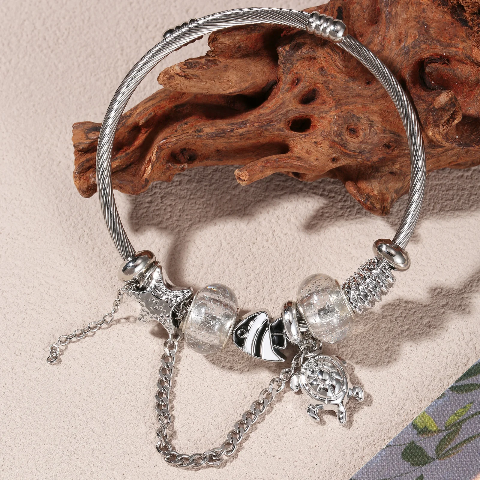 Silvery Stainless Steel Ocean Charm Bangle with Turtle and Shell Pendants for Women
Silvery Stainless Steel Ocean Charm Bangle with Turtle and Shell Pendants for Women