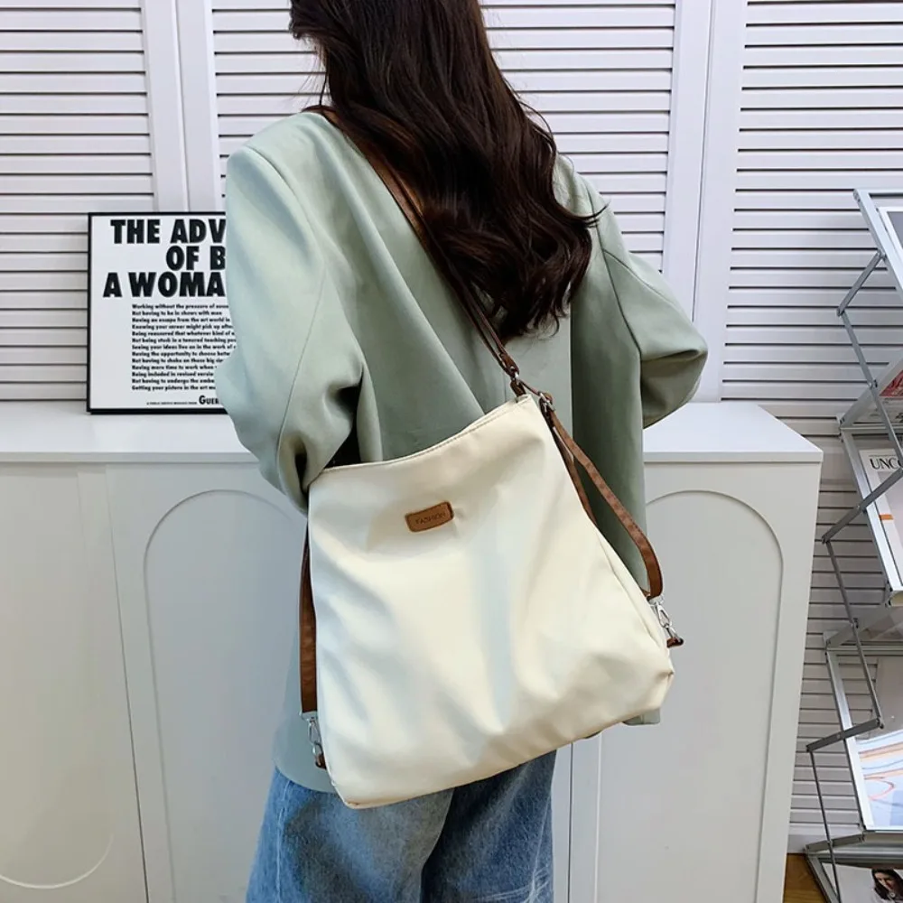 Нейлоновые рюкзаки двойного назначения на плечо, многофункциональная холщовая сумка-тоут большой вместимости, дорожная сумка через плечо в корейском стиле 
Нейлоновые рюкзаки двойного назначения на плечо, многофункциональная холщовая сумка-тоут большой вместимости, дорожная сумка через плечо в корейском стиле