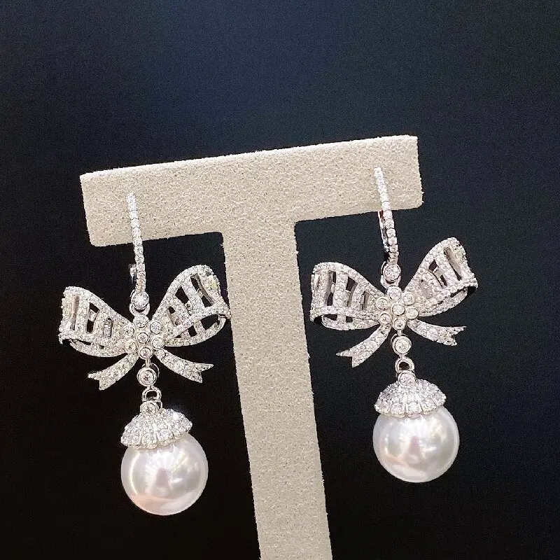 ARIGAYA 925 Sterling Silver 5A Zircon Round Blue Turquoise Or Green Agate Bowknot Or White Pearl Dangle Earrings
ARIGAYA 925 Sterling Silver 5A Zircon Round Blue Turquoise Or Green Agate Bowknot Or White Pearl Dangle Earrings