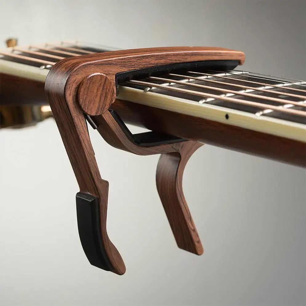 Guitar Capo Acoustic Electric Wood Grain Precise Design Stable Performance Easy Use Long Life Delicate Colorful Rubber Padded
Guitar Capo Acoustic Electric Wood Grain Precise Design Stable Performance Easy Use Long Life Delicate Colorful Rubber Padded