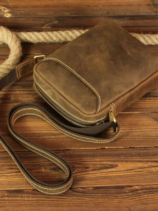 Винтажная кожаная сумка через плечо для мужчин, горизонтальная сумка через плечо на одно плечо, молодежная повседневная модная сумка небольшого размера из воловьей кожи
Винтажная кожаная сумка через плечо для мужчин, горизонтальная сумка через плечо на одно плечо, молодежная повседневная модная сумка небольшого размера из воловьей кожи