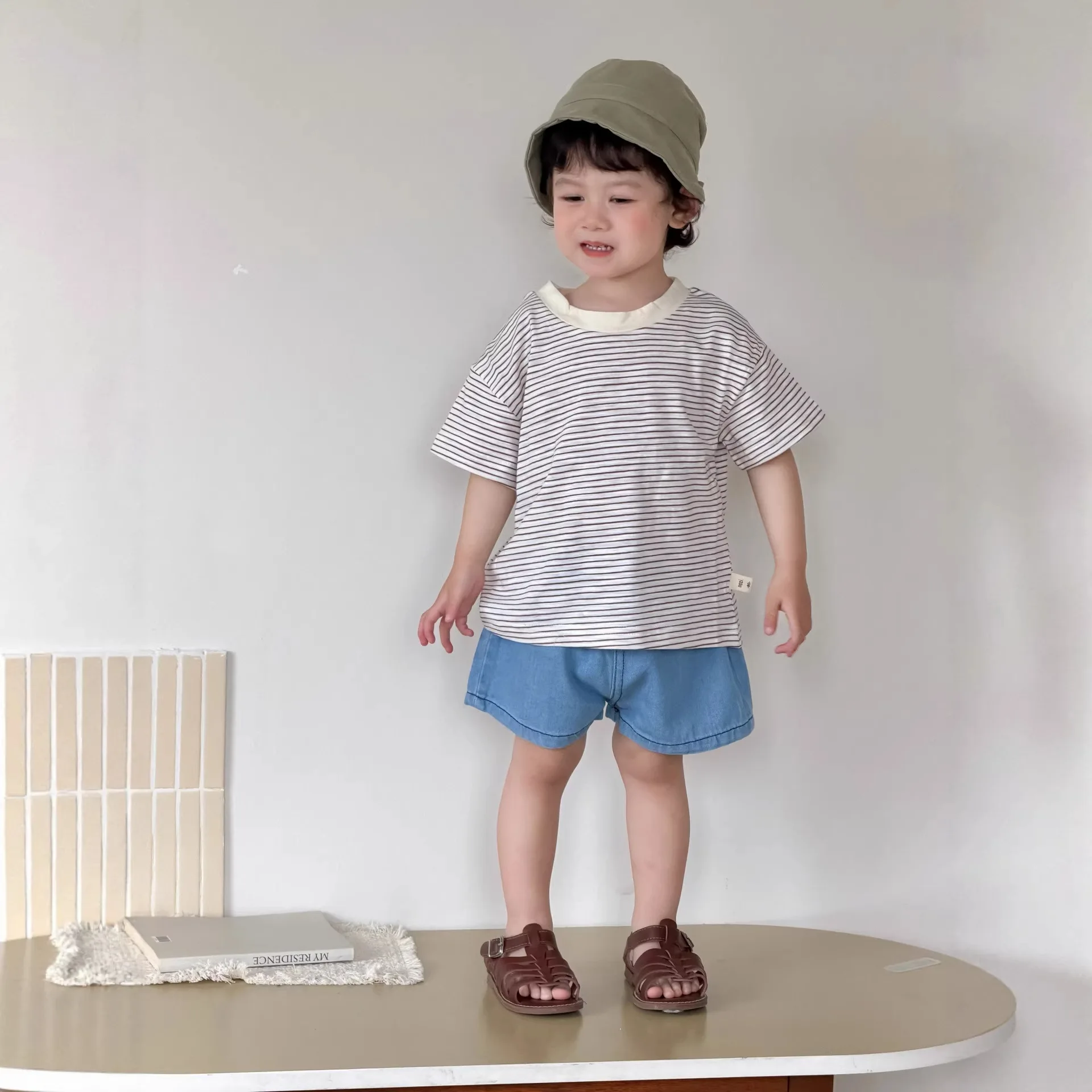 Summer baby clothes Korean version children's clothing 2026 new boys' striped T-shirt denim shorts set
Summer baby clothes Korean version children's clothing 2026 new boys' striped T-shirt denim shorts set
