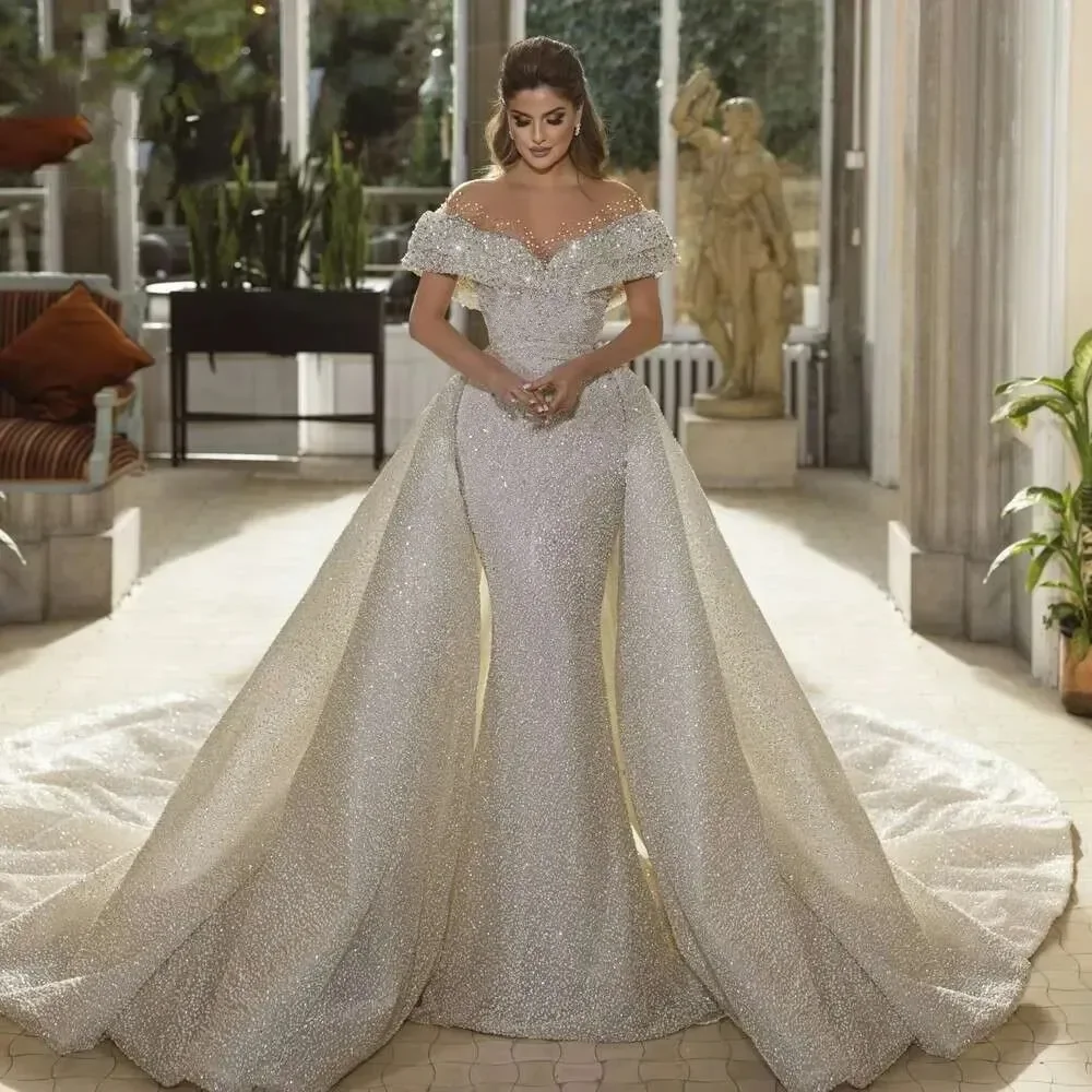 Customized Off the Shoulder Sparkly Fully Beads Sequins Wedding Dress Long Sleeves Luxury Bridal Dress with Removable Skirt
Customized Off the Shoulder Sparkly Fully Beads Sequins Wedding Dress Long Sleeves Luxury Bridal Dress with Removable Skirt