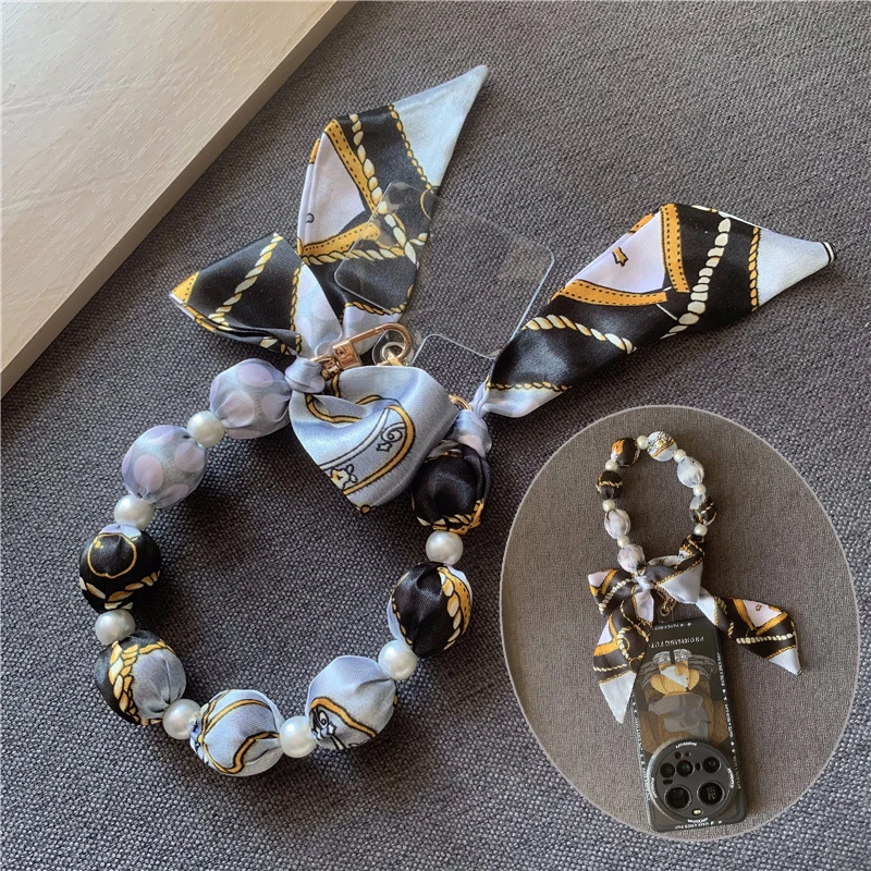 Bow Tie Mobile Phone Lanyard Beaded Wrist Chain Scarf Cellphone Strap Bag Hanging Decoration Universal Hand Bag Phone Pendant
Bow Tie Mobile Phone Lanyard Beaded Wrist Chain Scarf Cellphone Strap Bag Hanging Decoration Universal Hand Bag Phone Pendant