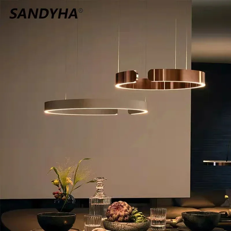 Современные креативные C-образные кольцевые люстры SANDYHA, светодиодная лампа для столовой, гостиной, блеск, салонный декор, подвесные светильники, освещение
Современные креативные C-образные кольцевые люстры SANDYHA, светодиодная лампа для столовой, гостиной, блеск, салонный декор, подвесные светильники, освещение