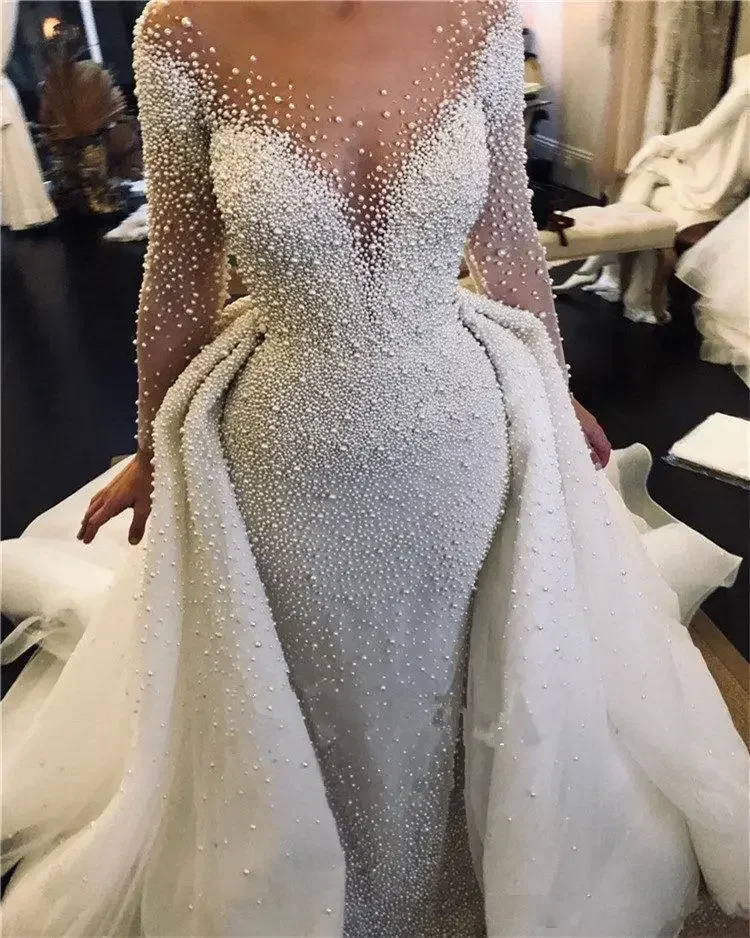 Customized Sparkly African Long Sleeves Wedding Dress With Detachable Train Luxury Full Pearls Beads Plus Size Bridal Gown
Customized Sparkly African Long Sleeves Wedding Dress With Detachable Train Luxury Full Pearls Beads Plus Size Bridal Gown