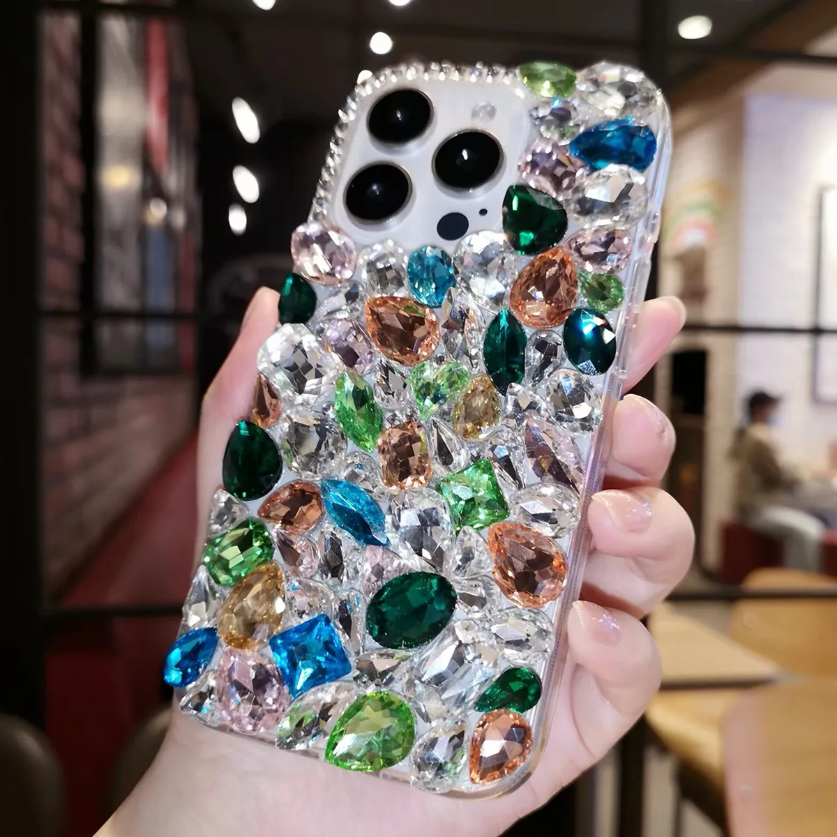 Suitable for iPhone, custom-made crystal-diamond colored gemstone phone case.
Suitable for iPhone, custom-made crystal-diamond colored gemstone phone case.