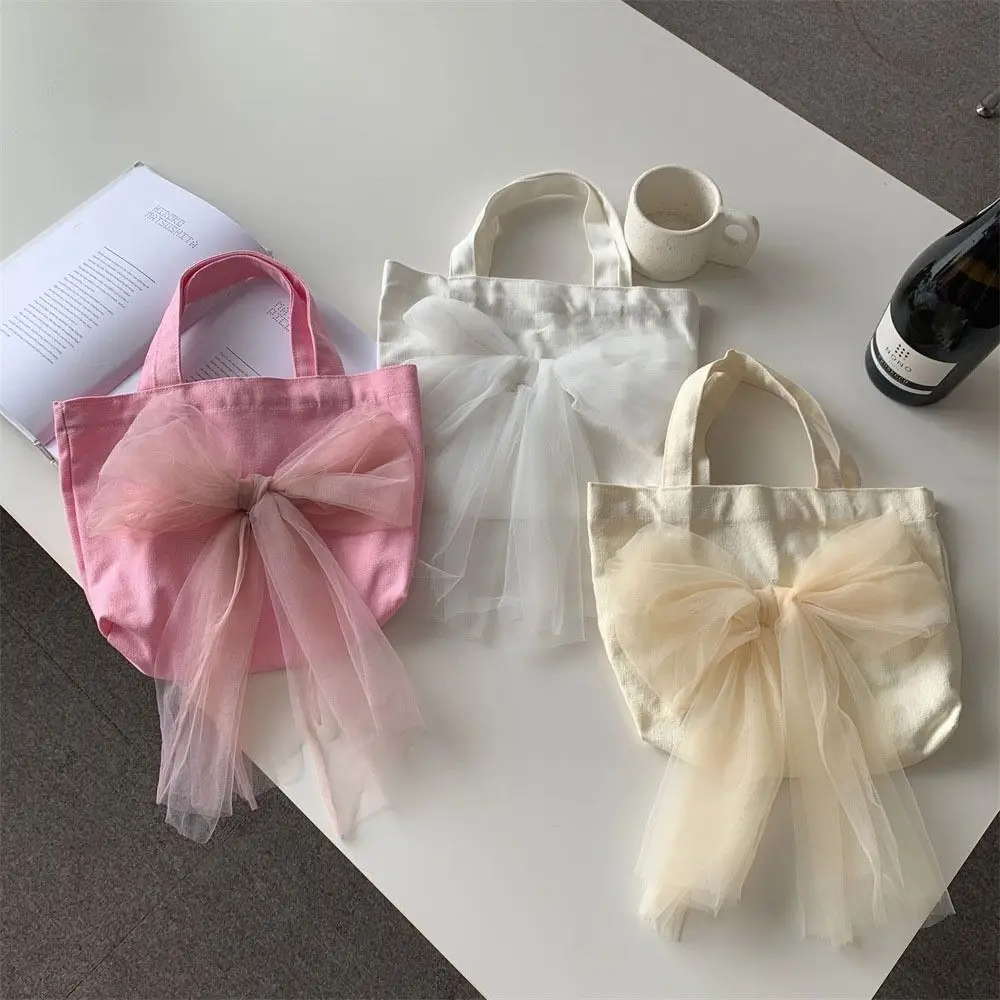 Casual Ribbon Bow Handbag Fairy Large Capacity Mesh Tote Bag Commuting Bag Korean Style Canvas Tote Bag Women
Casual Ribbon Bow Handbag Fairy Large Capacity Mesh Tote Bag Commuting Bag Korean Style Canvas Tote Bag Women