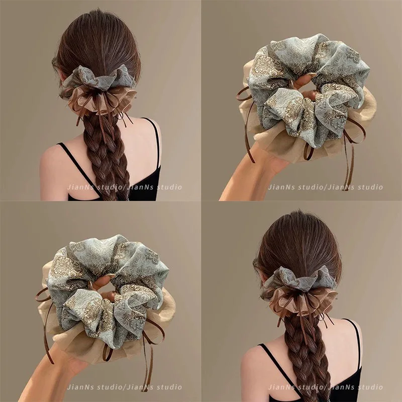 High retro floral ribbon headband, women's ponytail tie, meatball head, fashionable and versatile hair accessory
High retro floral ribbon headband, women's ponytail tie, meatball head, fashionable and versatile hair accessory