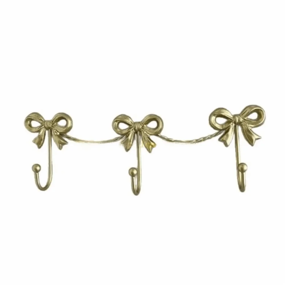 Golden Finish Metal Bow Wall Hooks Iron Material Smooth Finish Decorative Hangers Minimalist Style Sturdy Metal Wall Hook
Golden Finish Metal Bow Wall Hooks Iron Material Smooth Finish Decorative Hangers Minimalist Style Sturdy Metal Wall Hook