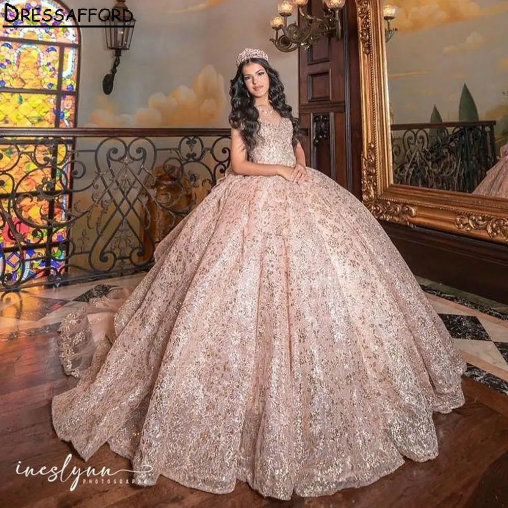 Rose Gold Sequined Lace Bow Quinceanera Dress Ball Gown Sweetheart Sleeveless Ruffles Corset Vestidos De Quinceañera
Rose Gold Sequined Lace Bow Quinceanera Dress Ball Gown Sweetheart Sleeveless Ruffles Corset Vestidos De Quinceañera