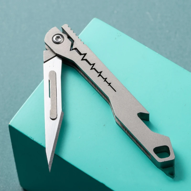 Titanium Alloy Folding Surgical Knife, Outdoor Portable Bottle Opening and Unboxing Knife, Comes with 10pcs Blades As A Gift
Titanium Alloy Folding Surgical Knife, Outdoor Portable Bottle Opening and Unboxing Knife, Comes with 10pcs Blades As A Gift