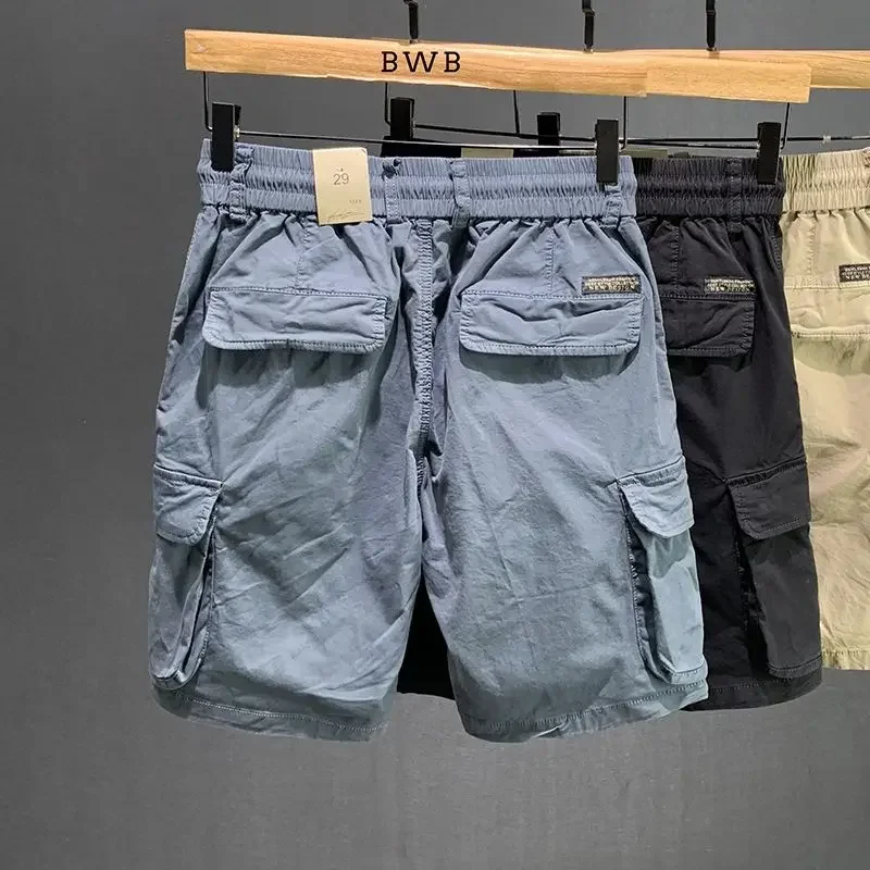 Мешковатые мужские шорты-бермуды с карманами, свободные длинные однотонные мужские шорты-карго с эластичной резинкой на талии, широкие шнурки, полупопулярные 
Мешковатые мужские шорты-бермуды с карманами, свободные длинные однотонные мужские шорты-карго с эластичной резинкой на талии, широкие шнурки, полупопулярные
