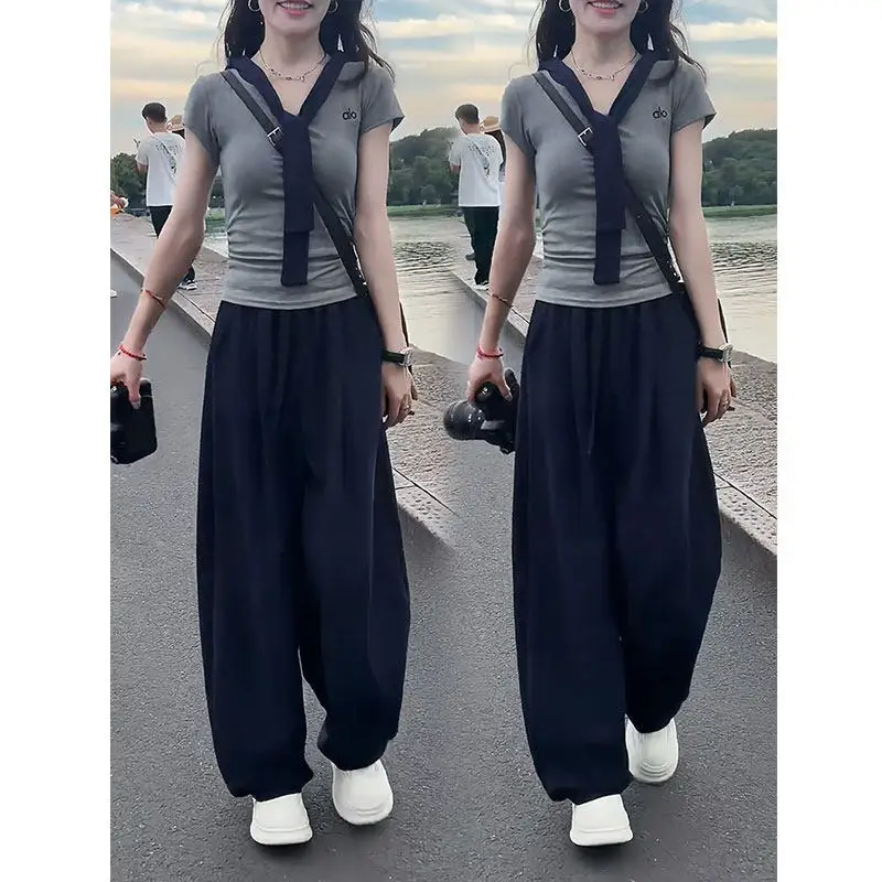 Fashion Women's Set 2026 Summer New Korean Version V-neck Short Sleeved Top+wide Leg Pants Two-piece Set
Fashion Women's Set 2026 Summer New Korean Version V-neck Short Sleeved Top+wide Leg Pants Two-piece Set