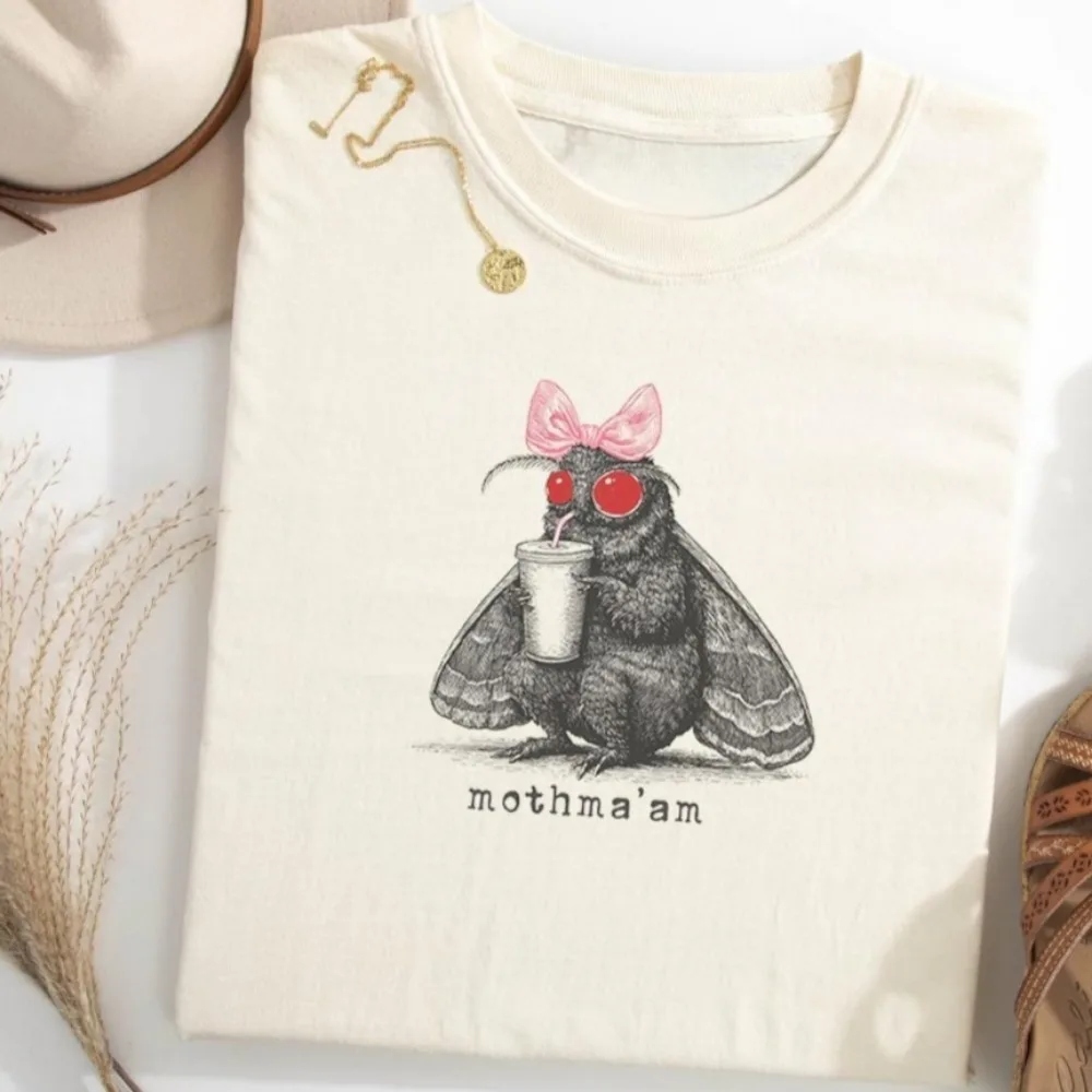 Mothma'am Funny Mothman Shirt Tee Cryptid Cryptids Moth Man Fantasy Supernatural T-shirt SciFi Sci Fi Horror Bow Iced Coffee
Mothma'am Funny Mothman Shirt Tee Cryptid Cryptids Moth Man Fantasy Supernatural T-shirt SciFi Sci Fi Horror Bow Iced Coffee