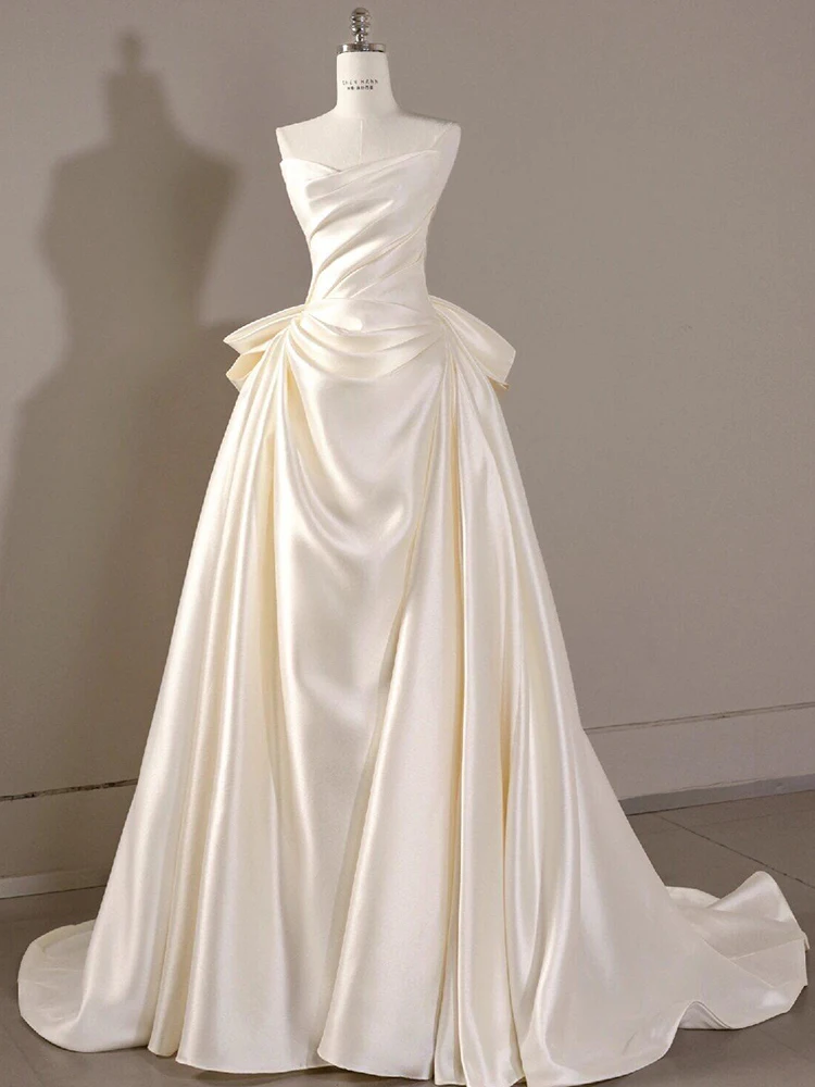 Ele Satin Bridal Gown with Strapl Design And Small Train Perfect for Wedding Guests And Hotel Indoor Ocns
Ele Satin Bridal Gown with Strapl Design And Small Train Perfect for Wedding Guests And Hotel Indoor Ocns