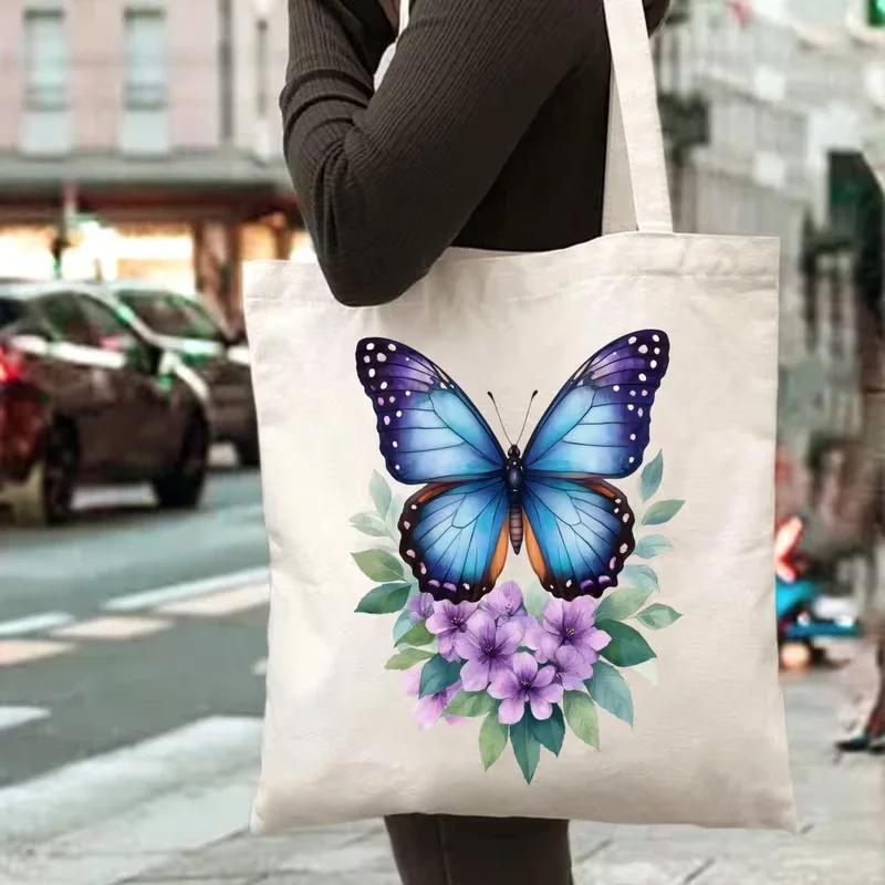 Watercolor Blue Butterfly Purple Floral Canvas Tote Bag Elegant Botanical Insect Print Shoulder Bag for School Travel Outdoor
Watercolor Blue Butterfly Purple Floral Canvas Tote Bag Elegant Botanical Insect Print Shoulder Bag for School Travel Outdoor